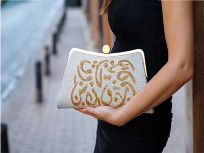 Gold Calligraphy Clutch